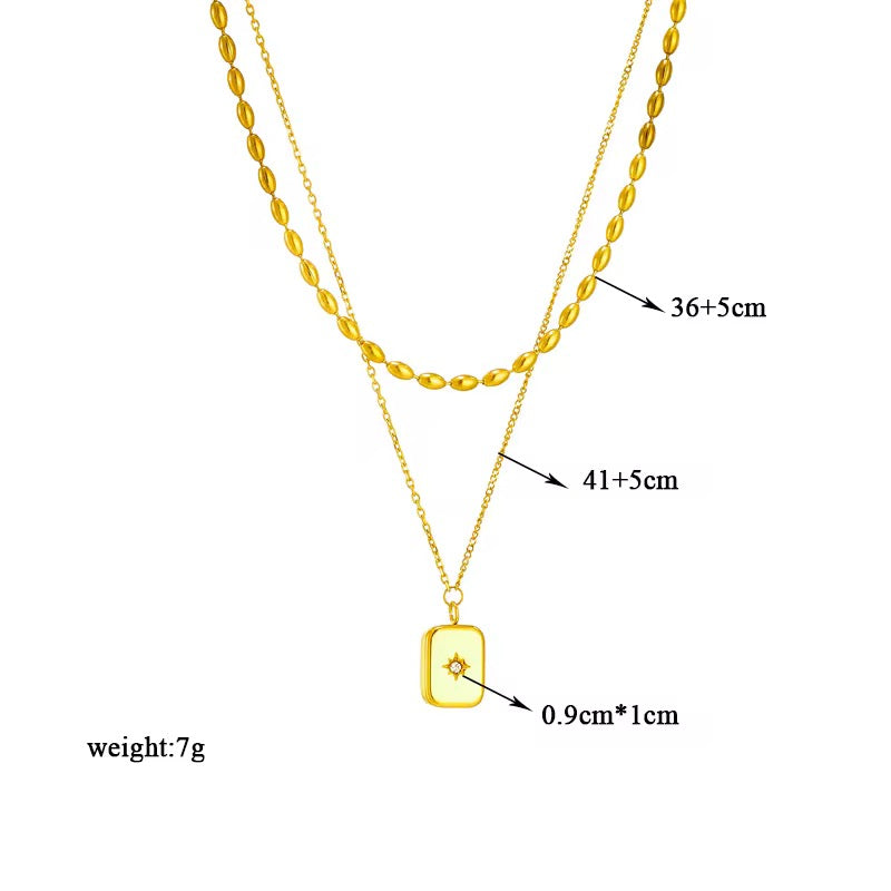 Gold double layer necklace with zirconia inlaid pendant