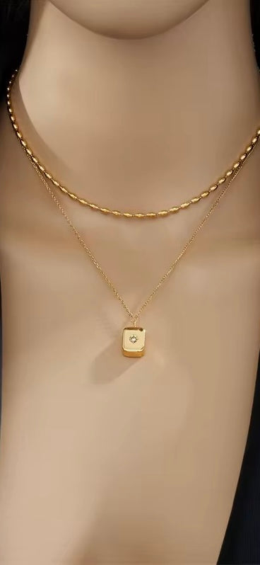 Gold double layer necklace with zirconia inlaid pendant